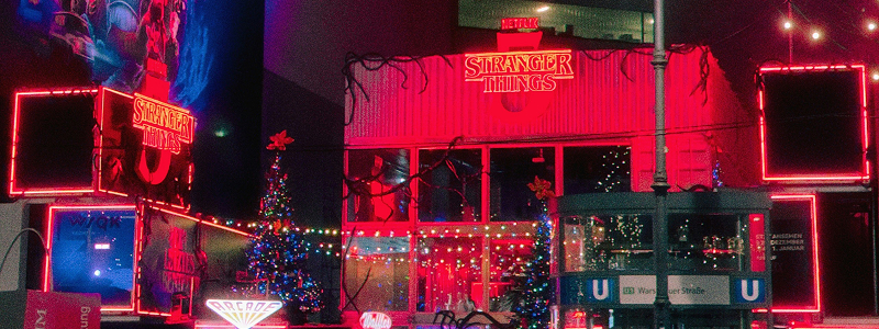 Nighttime venue entrance with colorful lights and signage